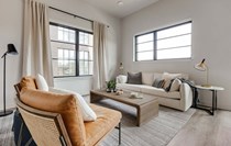Experience the warmth and style of this contemporary living area, perfect for relaxation.