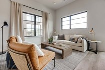 Experience the warmth and style of this contemporary living area, perfect for relaxation.