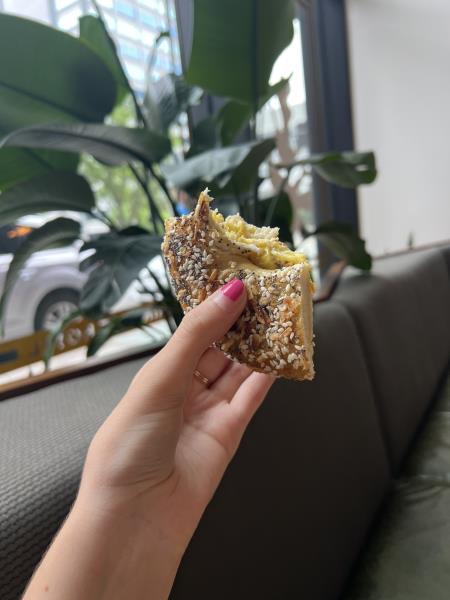 Everything Bagel Holding an Everything Bagel